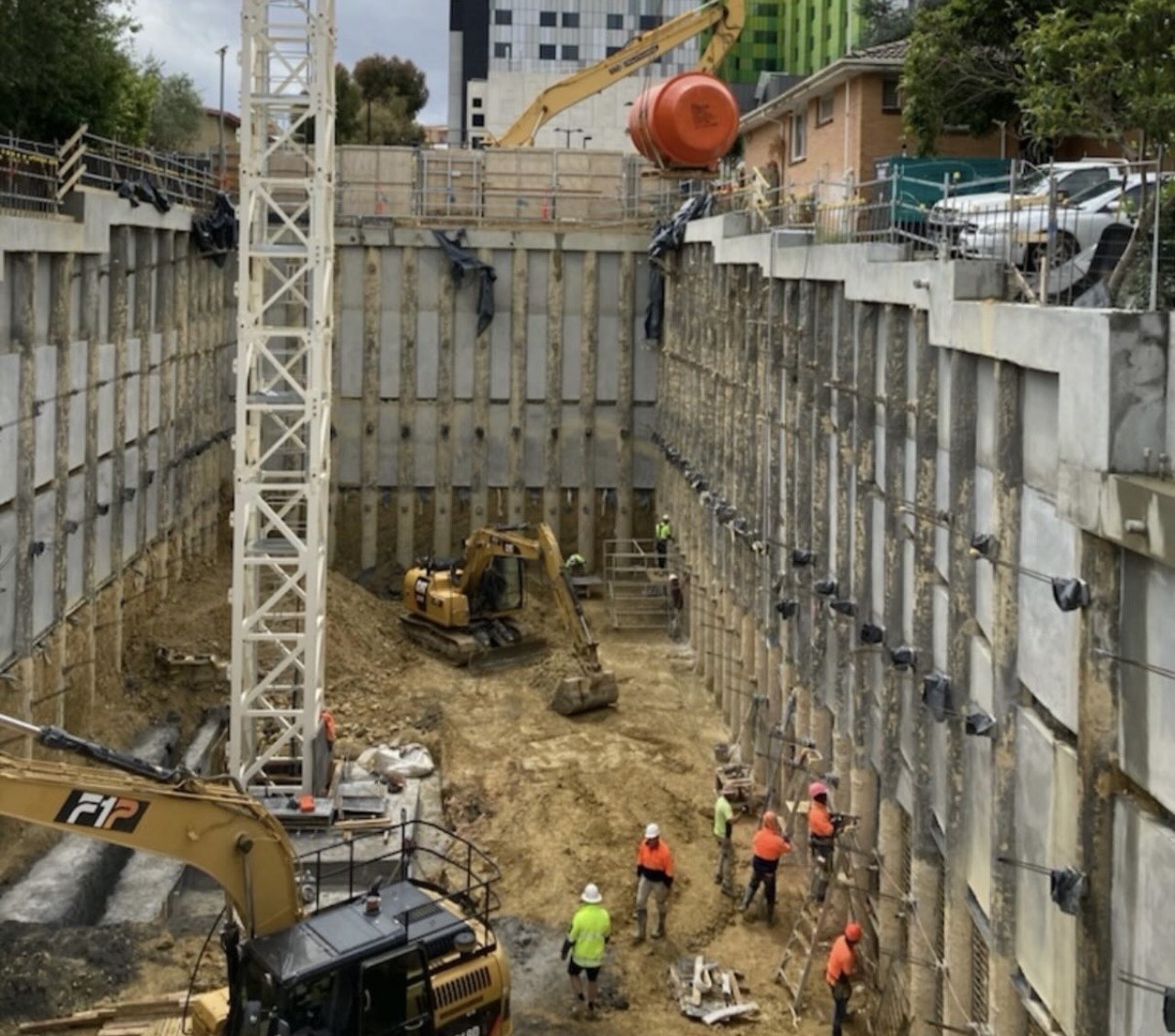 Westgate Plumbing on a major Melbourne commercial excavation site with crane and excavators