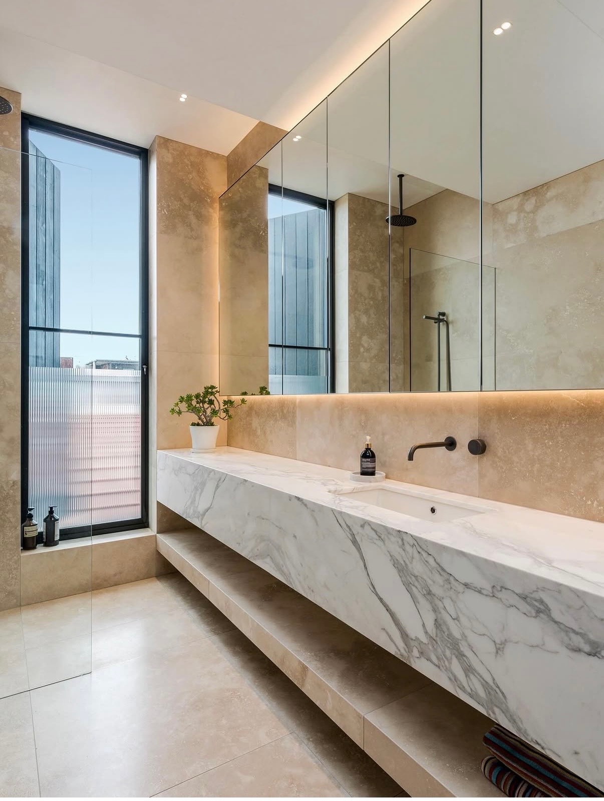 High-end marble bathroom with black tapware